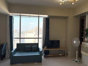 TV - Cozy Corner Studio condo in across NAIA T3 with Balcony (Pasay City)