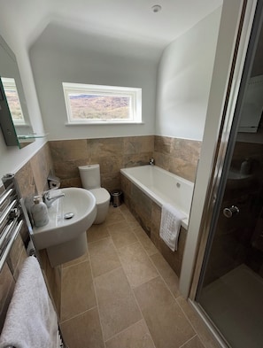 Shower, hair dryer, towels, soap