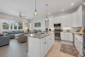 Fridge, microwave, oven, stovetop - On Ocean Time: 5 Houses to Gulf, Pool by Anna Maria Life Vacation Rentals (Holmes Beach)