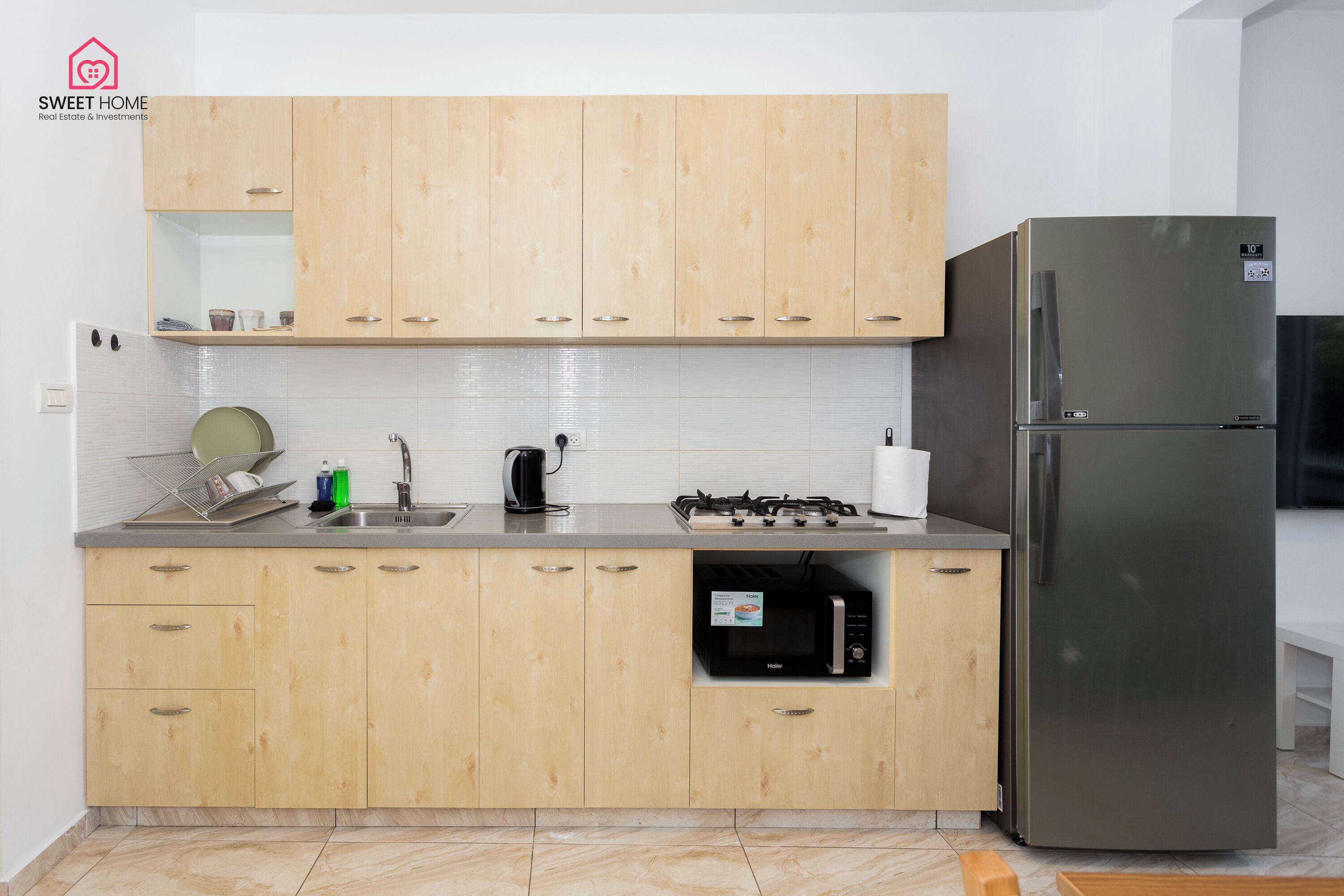 Family Apartment | Private kitchen | Full-sized fridge, microwave, stovetop, high chair