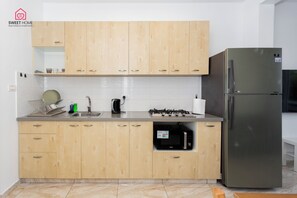 Family Apartment | Private kitchen | Full-size fridge, microwave, stovetop, highchair - Quiet Oasis in the Center (Netanya)