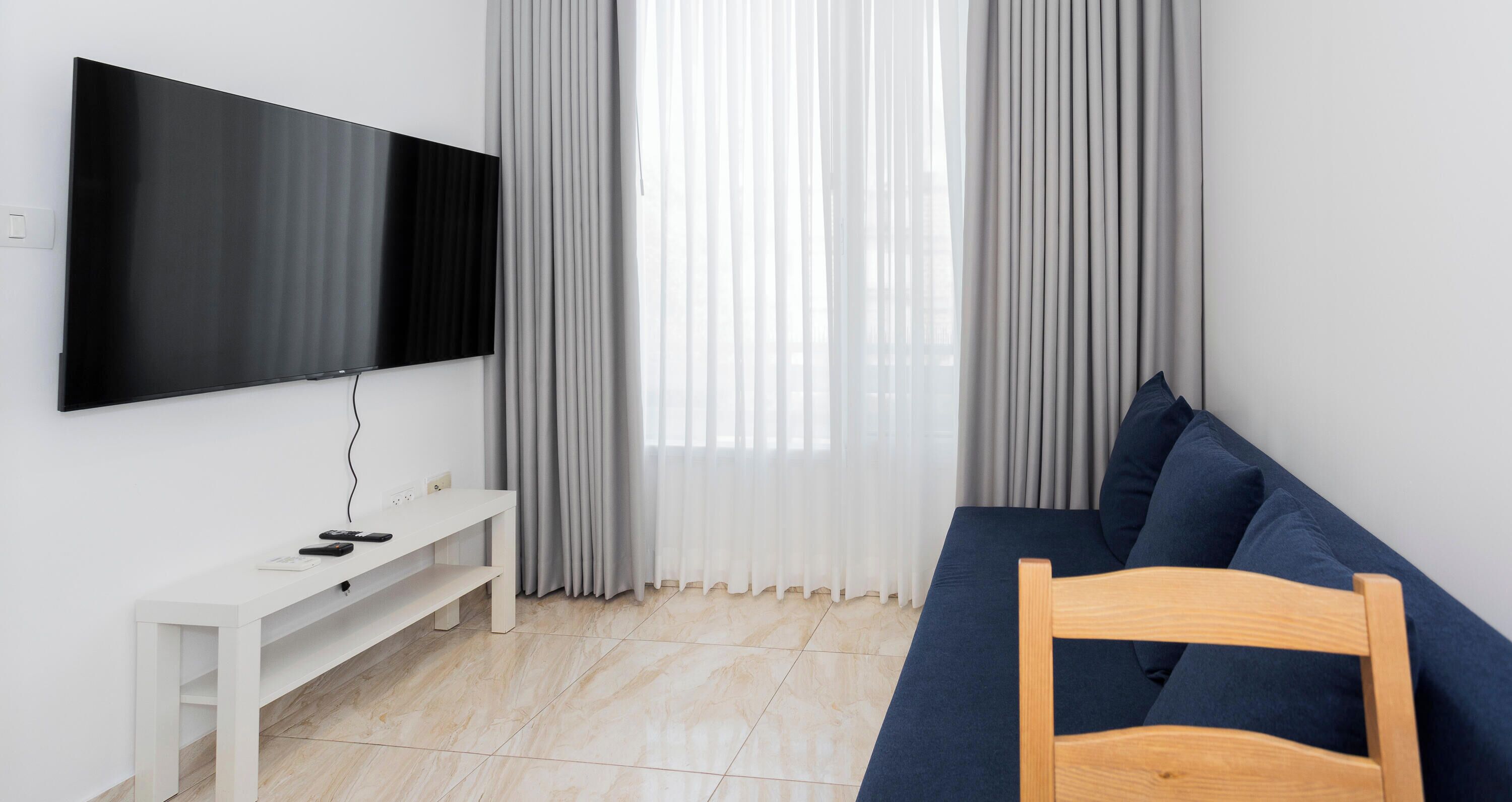 Family Apartment | Living area | Flat-screen TV