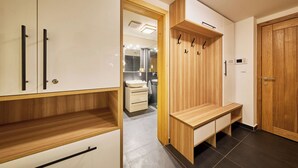 A modern bathroom with a vanity, mirror, and towel rack. - Na Kovárně by Interhome (Pec pod Snezkou)