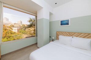 Departamento, cocineta, vista al jardín | Wifi gratis y ropa de cama 