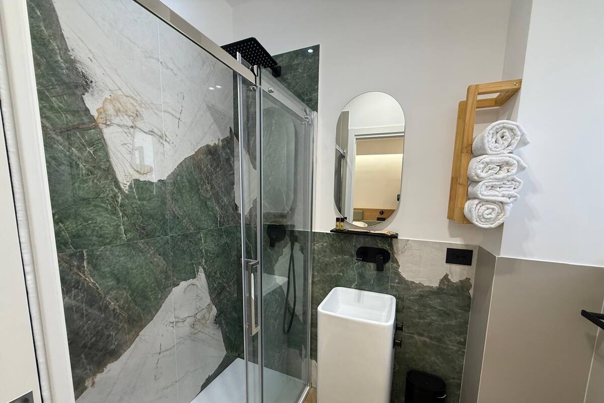 Habitación cuádruple de lujo, vista a la ciudad | Baño