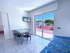 Apartment, 1 Bedroom, Balcony, Garden View | Living room - Lido dei Pini Modern Escape (San Michele al Tagliamento)