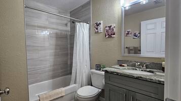 Hair dryer, towels, soap, toilet paper