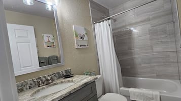 Hair dryer, towels, soap, toilet paper