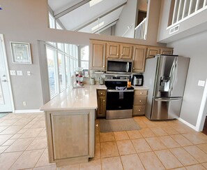 Fridge, microwave, oven, stovetop - Luxury Lakefront home with Million Dollar Views, 5 Bedroom, 3 Bathroom, Private Dock, Lakefront Decks, Grill, Kayaks, Gourmet Kitchen, Walkin Shower, Panoramic Lakeviews, Sleeps 16PP (SUNRISE BEACH)