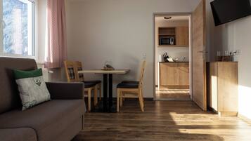 Superior Apartment, 1 King Bed with Sofa bed, Balcony, Mountain View | Living area | 29-inch flat-screen TV with satellite channels