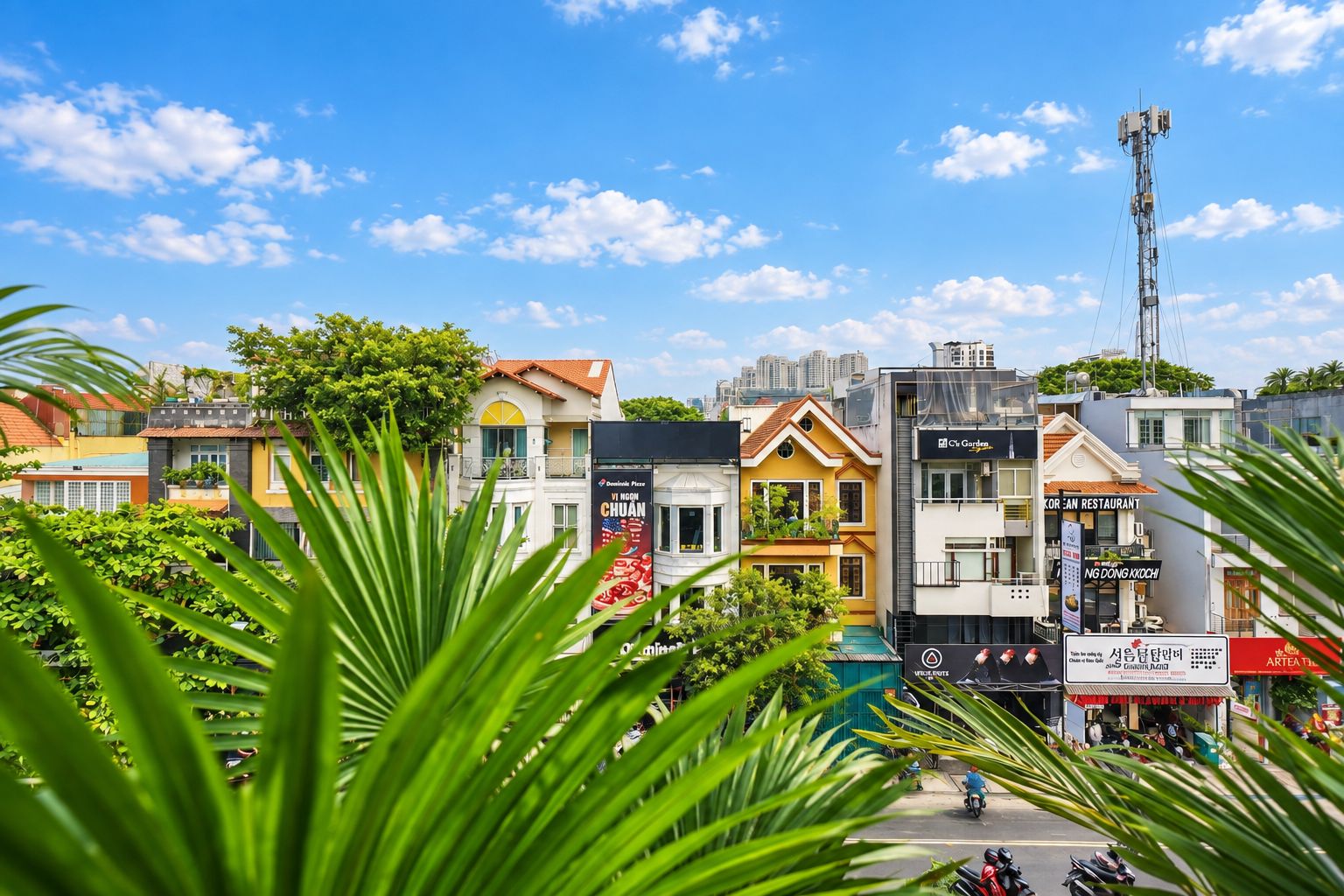 A row of colorful buildings with various signs, including a Korean restaurant and a place called 'Ng Dong Kkoi'.