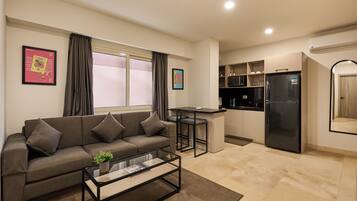 Apartment, 1 Bedroom, Courtyard View | Living area | 55-inch Smart TV with digital channels, Netflix, streaming services
