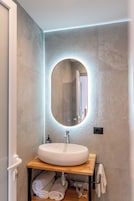 Shower, hair dryer, slippers, towels