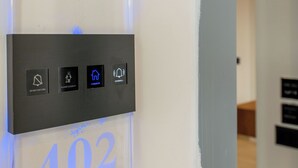 A hotel room number sign with 'ENAD HOTEL' and '402' illuminated. - Hotel ENAD (Ksamil)