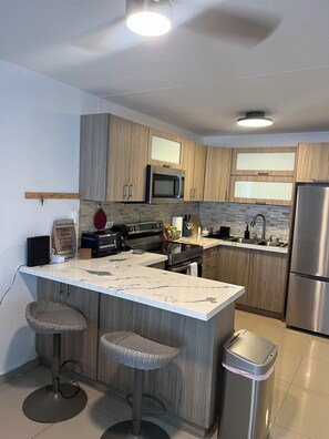 Private kitchen - Tranquil 3-bedroom house with AC in Carolina (Carolina)