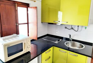 Apartemen, 1 kamar tidur, patio | Dapur kecil pribadi