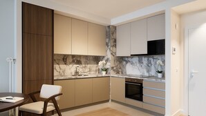 A modern kitchen with a marble backsplash, wooden cabinets, and a built-in oven. - Boutique Hotel Echo Residence (Belgrade)