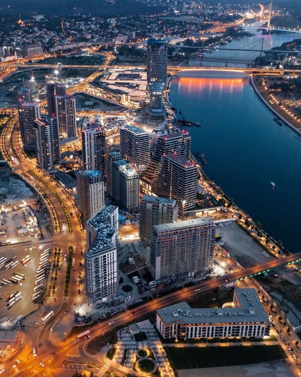 A high-rise urban area with modern buildings, a waterfront, and a bridge. - Boutique Hotel Echo Residence (Belgrade)