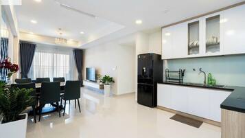 Deluxe Apartment, 3 Bedrooms, Non Smoking, City View | Living area | 24-inch TV with digital channels