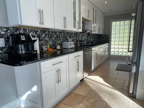 Private kitchen - Beautiful 3 bedroom building with swimming pool surrounded by wooded area . (St. Augustine)