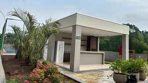 A modern building with a flat roof and a covered entrance area. - Mel Prime Executive Loft Extrema MG (Extrema)