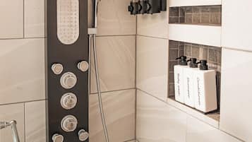 Shower, hair dryer, towels, soap