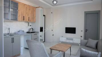 Family Studio Suite, Partial Sea View | Living area