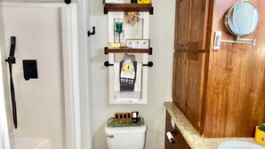 A compact bathroom with a shower, toilet, and sink. - Luxury Amenity-loaded Tiny Home w/ Pet Yard +EVCharg (Collin County)