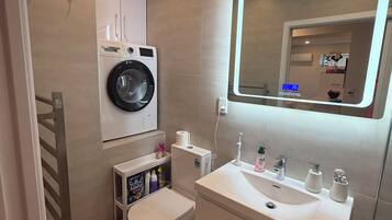 Hair dryer, towels, soap, toilet paper