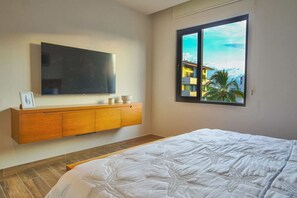 1 bedroom, desk, iron/ironing board, travel crib