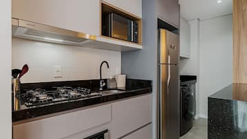Comfort Apartment | Private kitchen | Fridge, microwave, stovetop, blender