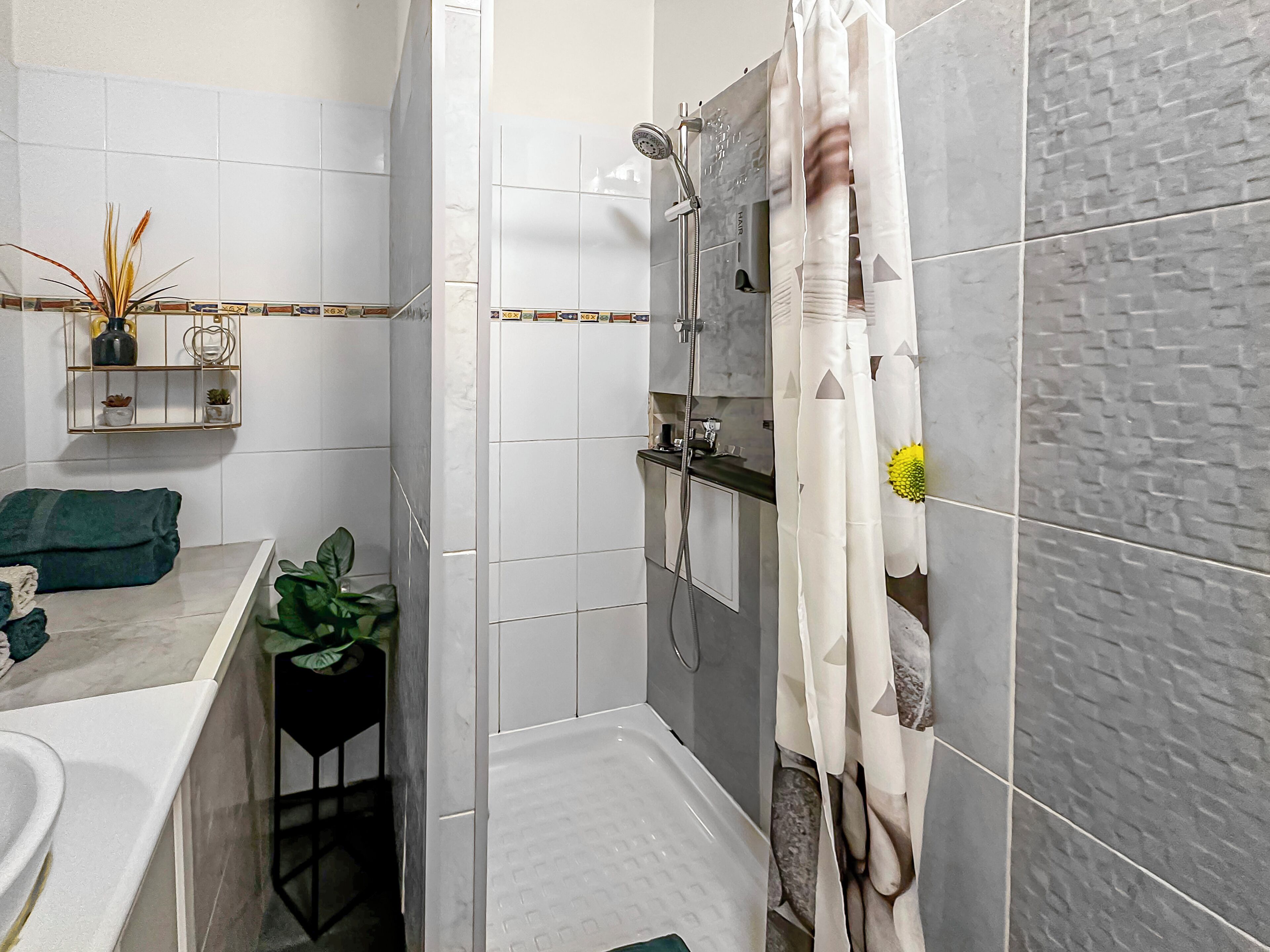 Shower, hair dryer, towels, soap