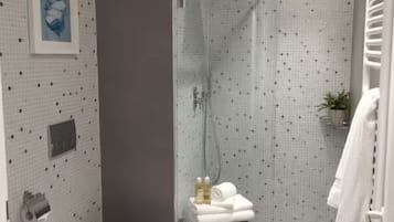 Hair dryer, towels, soap, shampoo