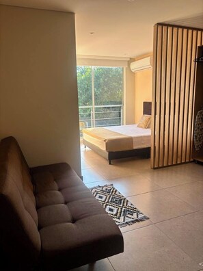 Deluxe Suite, Balcony, City View | Iron/ironing board, free WiFi