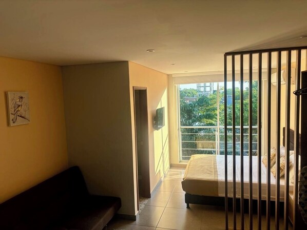 Deluxe Suite, Balcony, City View | Iron/ironing board, free WiFi