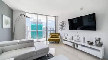 Luxury Apartment, Balcony, City View | Living area | 55-inch Smart TV with cable channels, Netflix, streaming services