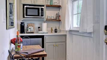 Fridge, microwave, coffee/tea maker, cookware/dishes/utensils