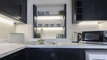 Fridge, oven, coffee/tea maker, cookware/dishes/utensils