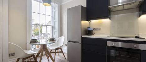 Fridge, oven, coffee/tea maker, cookware/dishes/utensils