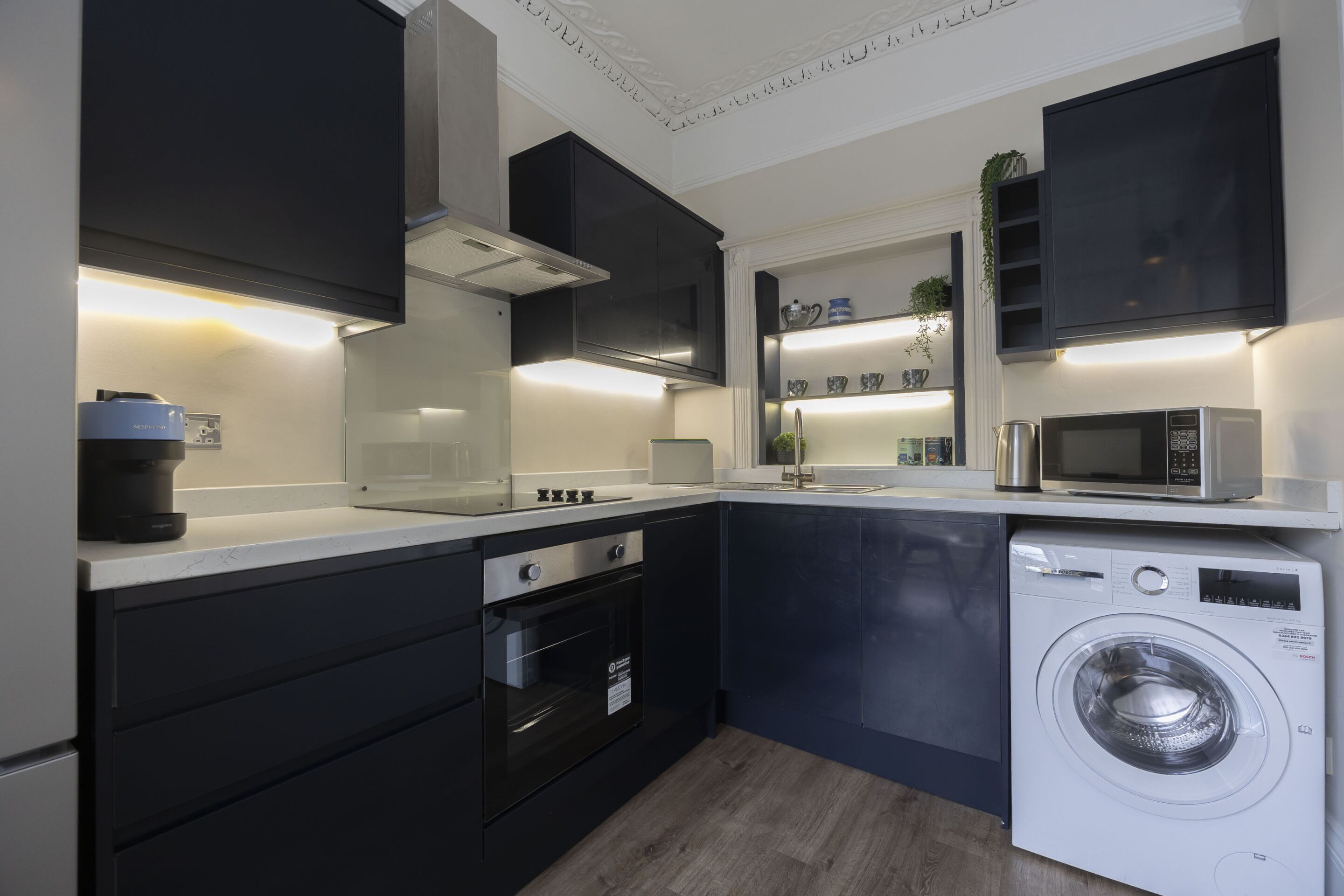 Fridge, oven, coffee/tea maker, cookware/dishes/utensils