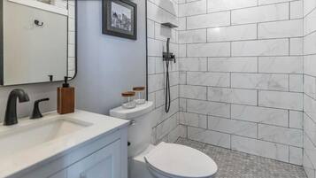 Shower, hair dryer, towels, soap