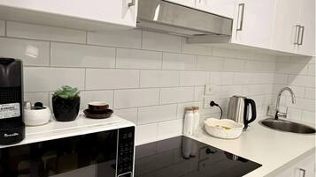 Fridge, microwave, stovetop, coffee/tea maker
