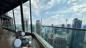 A high-rise building with a panoramic city view, including a distinctive tower and The Ruma building. - Imperial Residence KLCC by Perkasa Ikon (Kuala Lumpur)