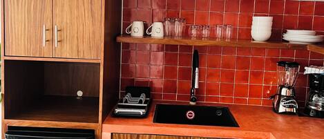 Fridge, microwave, coffee/tea maker, cookware/dishes/utensils