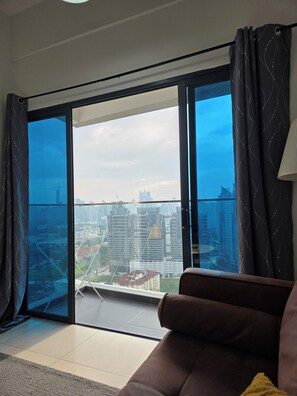 Standard Apartment, Balcony, City View | Living area | 50-inch LED TV with digital channels - Reizz Residence by Perkasa Ikon (Kuala Lumpur)