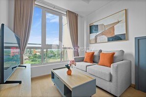 Departamento, 1 habitación, vista a la ciudad | Área de sala de estar | Smart TV, Netflix y servicios de streaming 