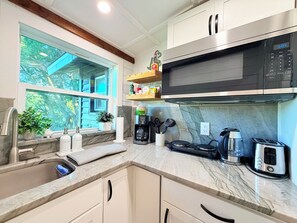 Fridge, microwave, stovetop, coffee/tea maker