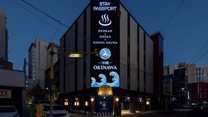 A building with a sign for Ryokan Okinawa, Stay Passport, and a CCTV security sign. - Stay Passport Okinawa Ryokan Bupyeong Incheon (Incheon)