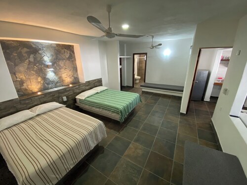 Costa Ayala suite 1 with 2 dbl bed and 2 sofas, all basics, 2 blocks from beach