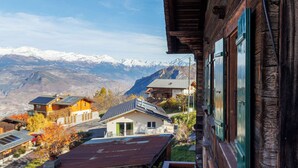 A wooden chalet with a balcony overlooking a mountainous landscape. - Les Agettes 1865 by Interhome (Les Mayens-de-Sion)